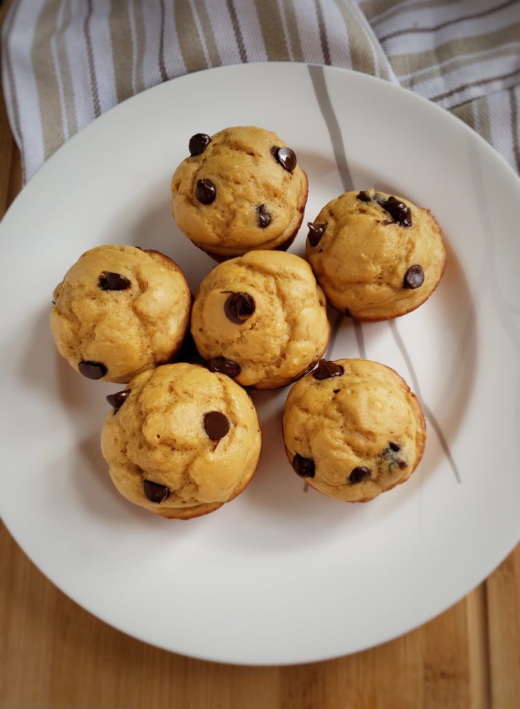 A delicious, quick and easy grab and go healthy snack recipe. A peanut butter cup protein muffin, featuring greek yogurt! So delicious for less than 150 calories.